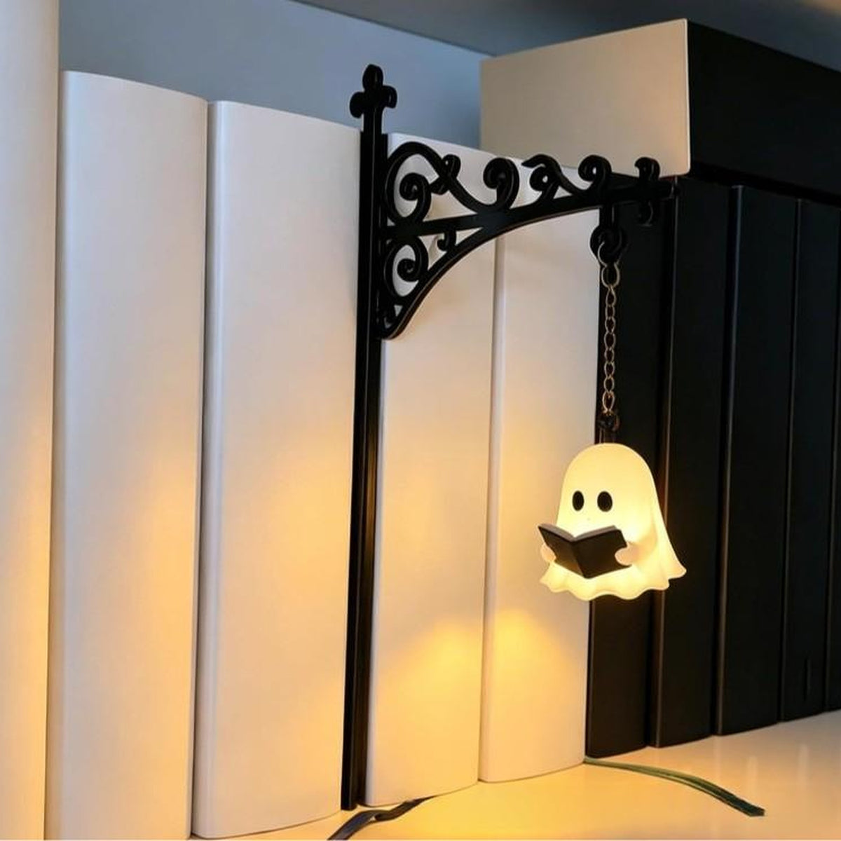 Reading ghost lantern glowing on a white bookshelf